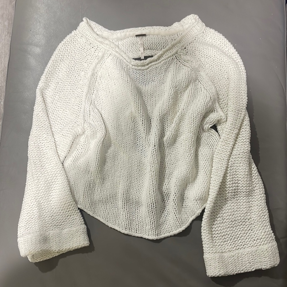 White knit sweater.